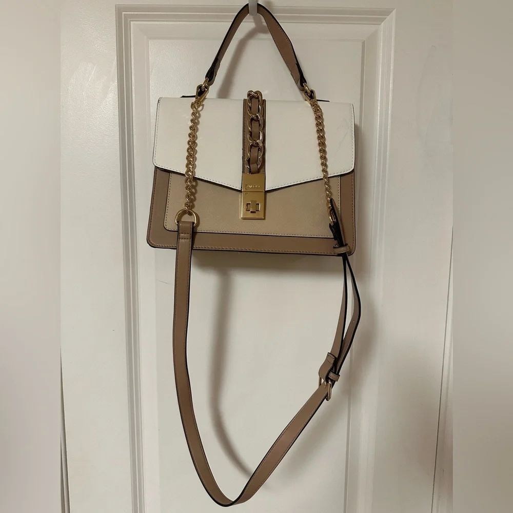 ALDO women's handbag with a top handle and chain detail.